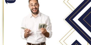 How to invest money Description: man holding several cash notes in both hands