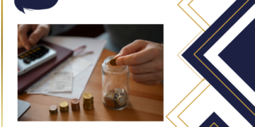 Saver’s credit: man saving money, in the image stacked coins and calculator and papers next to the man's hand putting coins inside a glass jar